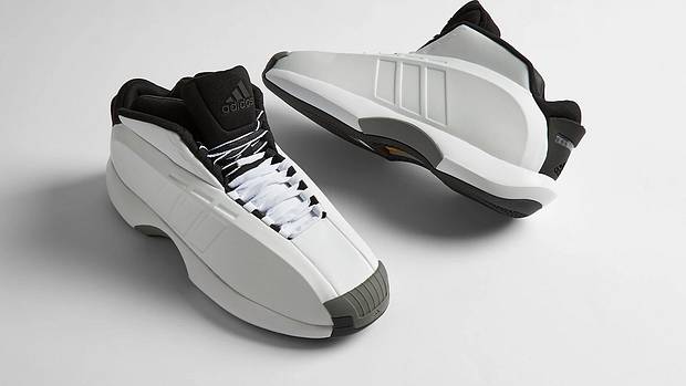 Side view of Kobe Bryant's white and black adidas shoes.