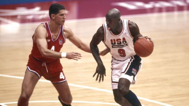 USA Dream Team guard Michael Jordan (9) is defended by Croatia guard Drazen Petrovic (4)