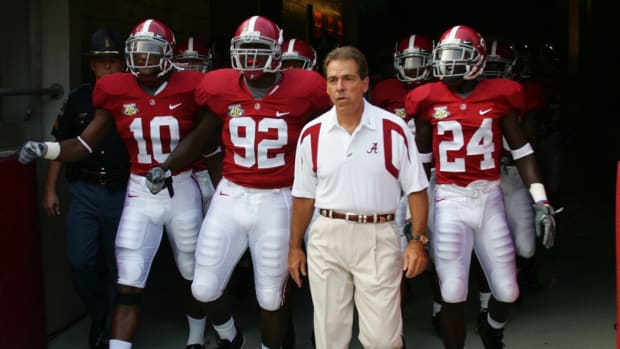 Alabama football coach Nick Saban and Crimson Tide players before a game in the SEC.