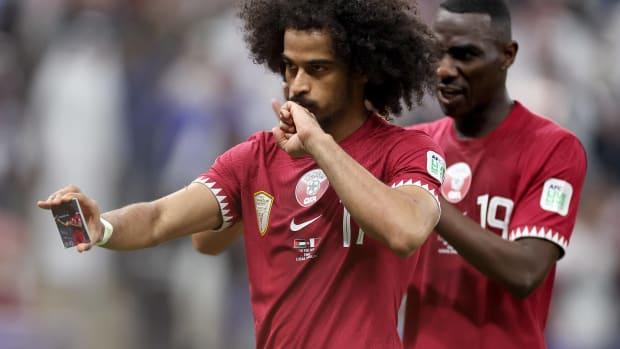 Akram Afif pictured performing a magic trick after scoring his first of three goals for Qatar against Jordan in the final of the 2023 AFC Asian Cup