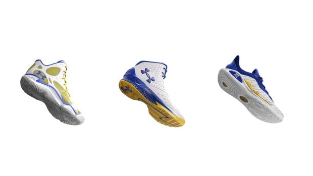Golden State Warriors guard Stephen Curry's white and blue Under Armour sneakers.