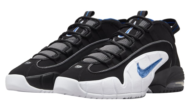 View of black and white Nike Air Penny shoes.