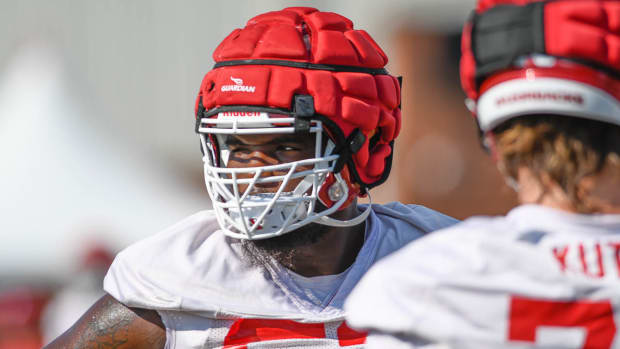 Offensive lineman Ty'Kiest Crawford during Wednesday's practice on the outdoor field at the football center in Fayetteville, Ark., where he worked a lot at right guard with projected starter Brady Latham out. 