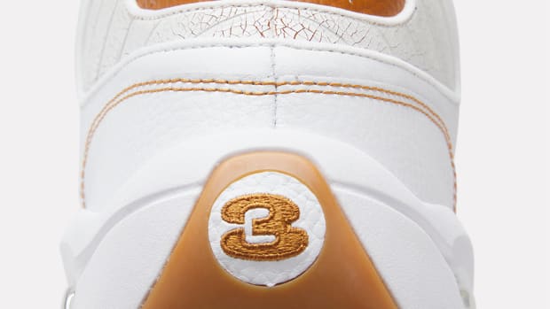 Rear view of Allen Iverson's white and brown Reebok sneakers.