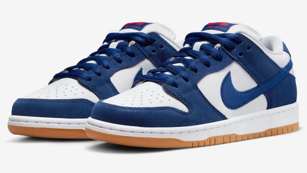 View of blue and white Nike Dunk Low shoes.