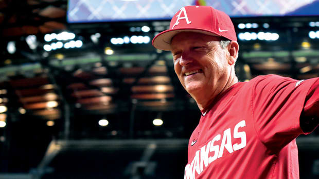 Arkansas coach Dave Van Horn is all smiles after the Razorbacks finally put up a run on Oklahoma State in the fifth inning at Globe Life Field.