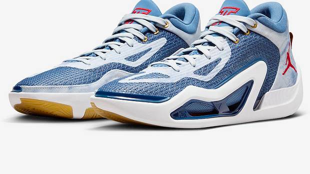 Side view of Jayson Tatum's blue, white, and red Jordan Brand shoes.
