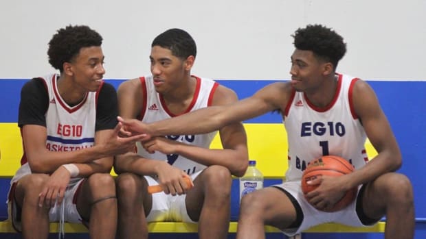 CJ Gunn (left), DJ Hughes (middle) and Tony Perkins (left) talk on the bench during their time on the EG10 AAU team. After being teammates at Lawrence North High School in Indianapolis, Ind., Gunn now plays for Indiana, Hughes plays for Butler and Perkins plays for Iowa. 