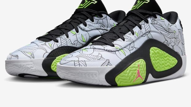 Side view of Jayson Tatum's white, black, and green Jordan Brand sneakers.