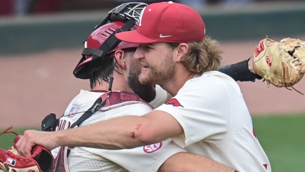 Pitcher Hunter Hollan embraces catcher Parker Rowland after complete game win over South Carolina