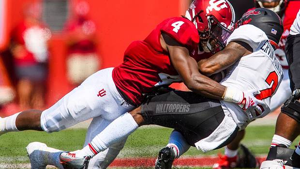 Indiana's Cam Jones (4) tackles Davion Ervin-Poindexter (2) during the Indiana versus Western Kentucky football game at Memorial Stadium on Sept. 17, 2022.