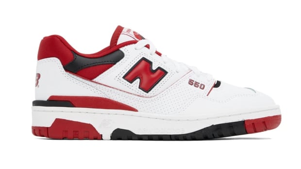 Side view of a white, red, and black New Balance sneaker.