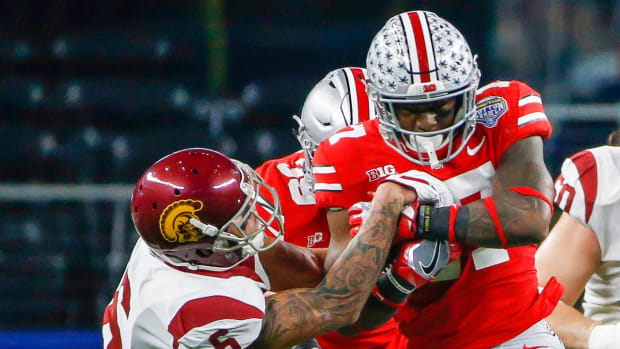 USC's Michael Pittman tries to strip Ohio State's Jerome Baker.