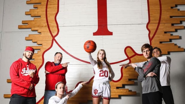 Julianna LaMendola poses with the Indiana women's basketball staff.