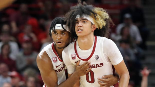 Arkansas guards Ricky Council and Trevon Brazile talk strategy against Troy.