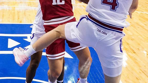Indiana Hoosiers forward Miller Kopp (12) has his shot blocked by Kansas Jayhawks guard Gradey Dick (4) during the second half at Allen Fieldhouse.