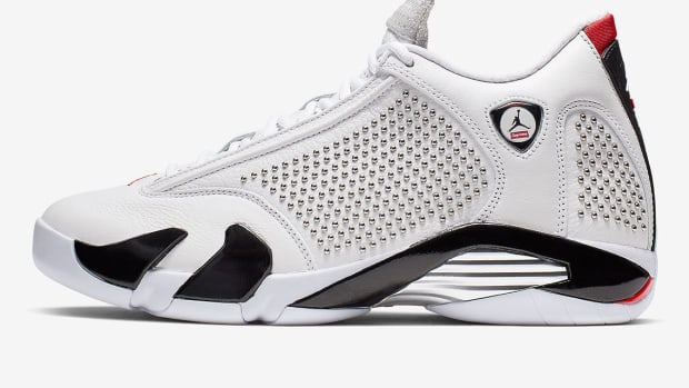 Side view of white and black Jordan shoe.