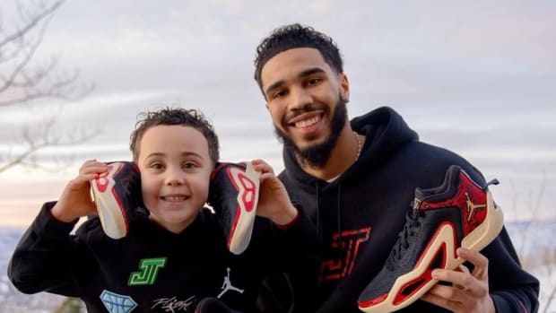 Jayson and Deuce Tatum pose with black sneakers.