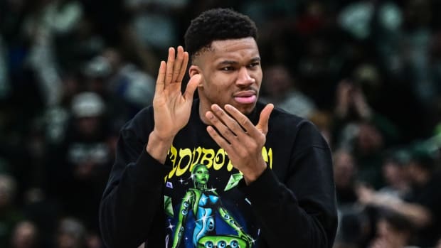 Milwaukee Bucks forward Giannis Antetokounmpo (34) cheers from the bench during game against the Indiana Pacers