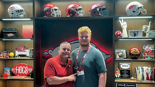 Wakeland High School offensive lineman Connor Stroh hangs out with Arkansas coach Sam Pittman during an April visit to Fayetteville. It was Stroh's second time to make the drive from Frisco, Texas in the span of just a few months.