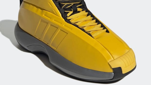 Yellow and black Adidas Kobe shoe.