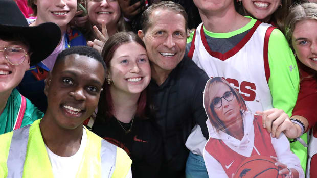 Arkansas Razorbacks coach Eric Musselman with fans after a game with the Georgia Bulldogs.
