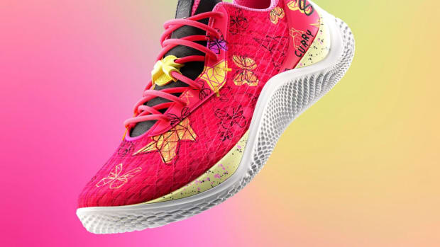 View of Stephen Curry's pink and yellow shoe.