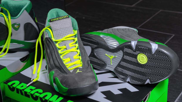 Green, grey, and yellow Air Jordan shoes.