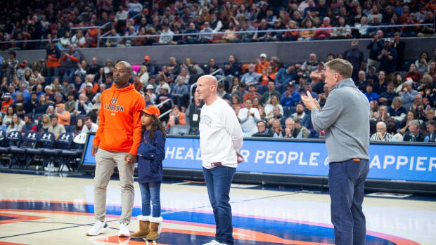 New Auburn Tigers football offensive coordinator Derrick Nix, from left, defensive coordinator Charles Kelly and head coach Hugh Freeze are introduced as Auburn Tigers basketball takes on Ole Miss Rebels at Neville Arena in Auburn, Ala., on Saturday, Jan. 20, 2024.