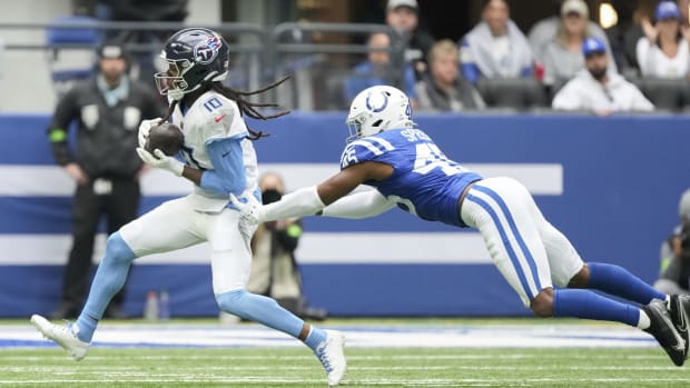 Indianapolis Colts linebacker E.J. Speed (45) dives after Tennessee Titans wide receiver DeAndre Hopkins (10) as he rushes the ball in the game Lucas Oil Stadium at Lucas Oil Stadium. 
