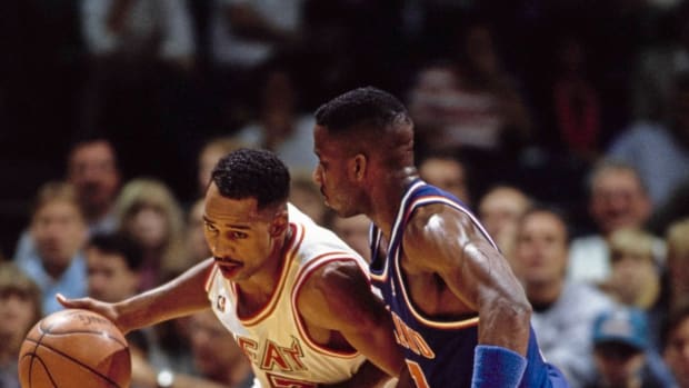 Keith Askins #2, Small Forward for the Miami Heat dribbles the basketball around #11 Terrell Brandon of the Cleveland Cavaliers during their NBA Atlantic Division basketball game on 11th December 1991 at the at the Miami Arena in Miami, Florida, United States. The Miami Heat won the game 105 - 103. 