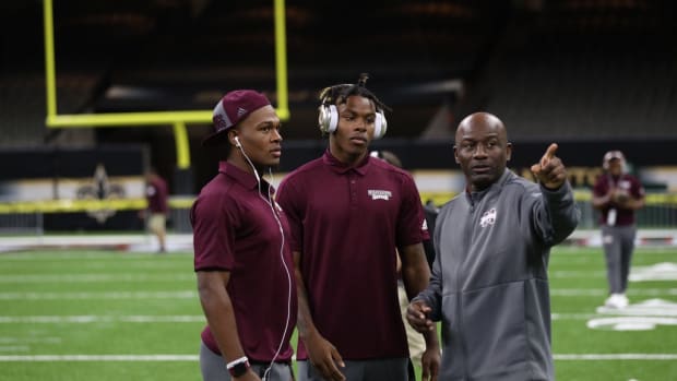 Mississippi State cornerbacks coach Terrell Buckley (far right) instructs freshmen corners Martin Emerson Jr. (middle) and Jarrian Jones (far left) during a walk through at Mercedes-Benz Superdome. (Mississippi State Athletics, Mississippi Clarion Ledger)