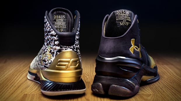 Rear view of Stephen Curry's white, black, and gold Under Armour shoes.