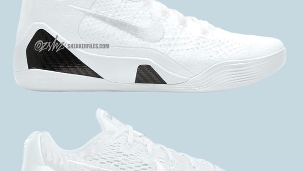 Side view of two pairs of Kobe Bryant's white Nike sneakers.