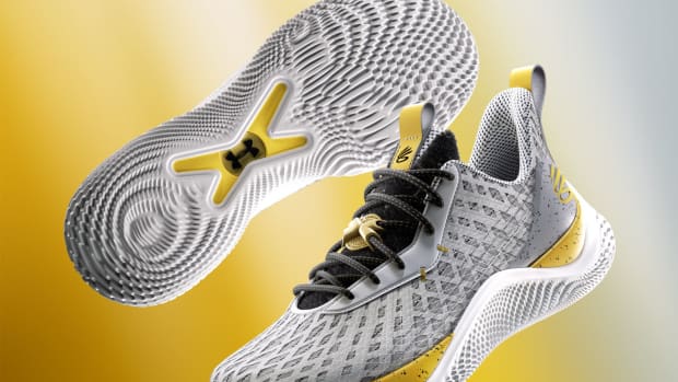 Detailed look at Stephen Curry's grey and gold shoes.