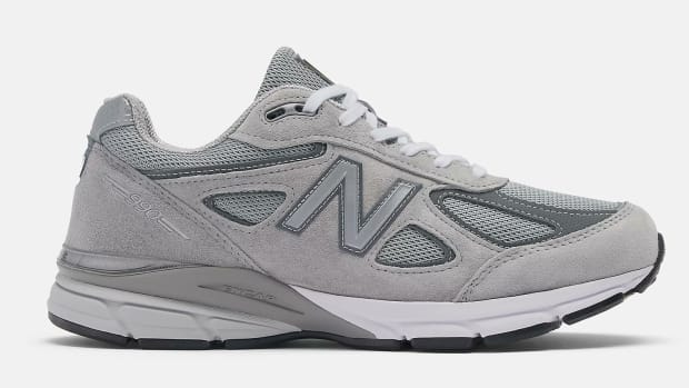 Side view of a grey New Balance shoe.