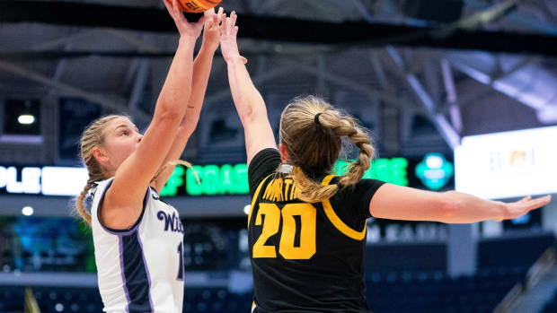 Kansas State Wildcats guard Gabby Gregory (12) shoots the ball while being guarded by Iowa Hawkeyes guard Kate Martin (20)during the first quarter of the Gulf Coast Showcase championship game at Hertz Arena in Estero on Sunday, Nov. 26, 2023.  