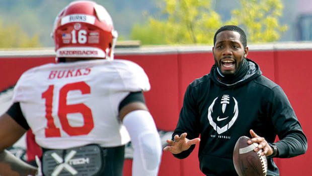 New Arkansas offensive coordinator Kenny Guiton works with wide receiver Treylon Burks back when Guiton was wide receivers' coach.