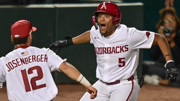 Arkansas Razorbacks designated hitter Kendall Diggs celebrates his walk-off hit against Illinois State in the 11th inning.