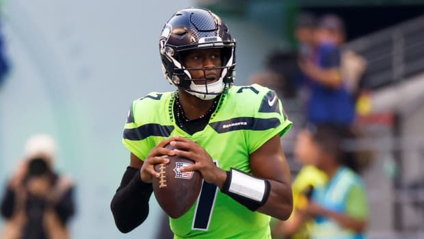 Seattle Seahawks quarterback Geno Smith (7) looks to pass against the Denver Broncos during the second quarter at Lumen Field.
