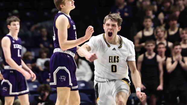 Centerville's Gabe Cupps reacts after hitting a 3-point shot during the Elks's 54-47 win over Elder Wednesday, March 8, 2023.