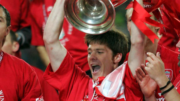 Xabi Alonso pictured lifting the UEFA Champions League trophy in May 2005 after Liverpool beat AC Milan in a famous final