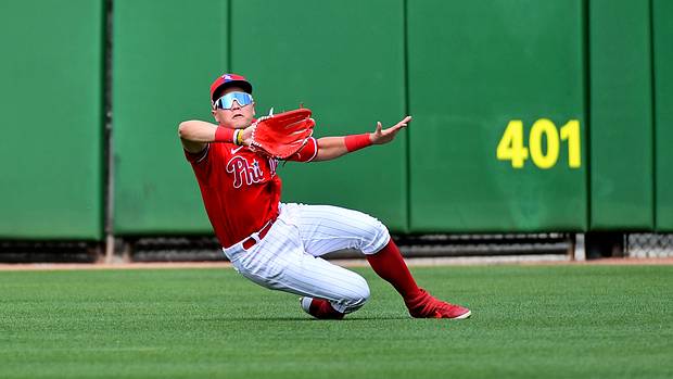 Muzziotti goes into a slide during a major league spring training game.