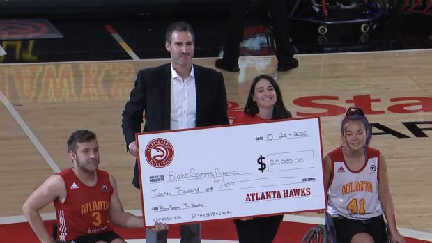 Atlanta Hawks presenting check to Blaze Sports.