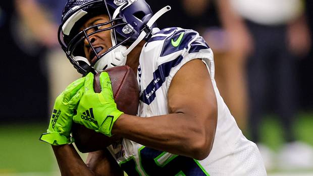 Seattle Seahawks wide receiver Tyler Lockett (16) catches a touchdown pass against New Orleans Saints cornerback Paulson Adebo (29) during the second half at Caesars Superdome.
