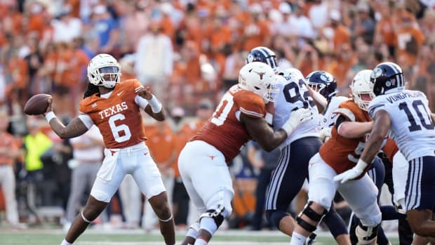 Texas Longhorns quarterback Maalik Murphy throws a touchdown pass to wide receiver Adonai Mitchell in the second quarter against the BYU Cougars at Royal-Memorial Stadium on Saturday October 28, 2023