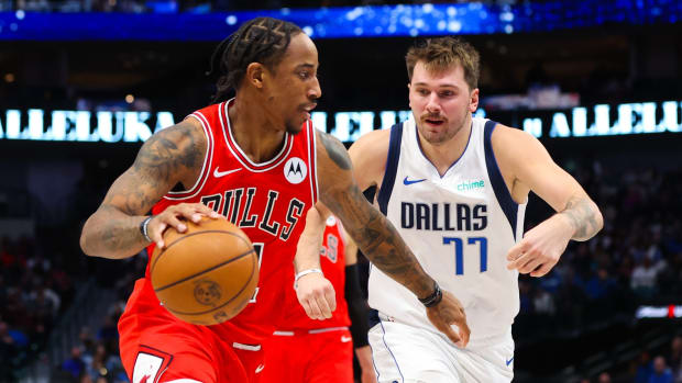 Chicago Bulls forward DeMar DeRozan (11) drives to the basket as Dallas Mavericks guard Luka Doncic (77) defends during the second half at American Airlines Center.
