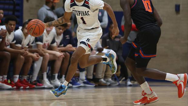 Stepinac's Boogie Fland (1) drives to the basket against Saint Raymond during boys basketball action at Stepinac High School in White Plains Jan. 20, 2023. Stepinac won the game 89-87. Fland finished the game with 40 points.