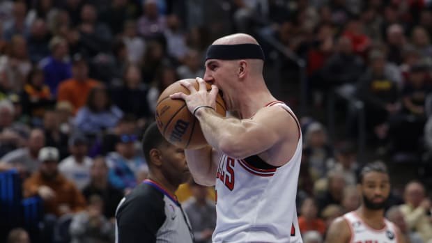November 28, 2022; Chicago Bulls guard Alex Caruso bites the ball during the game against the Utah Jazz at Vivint Arena