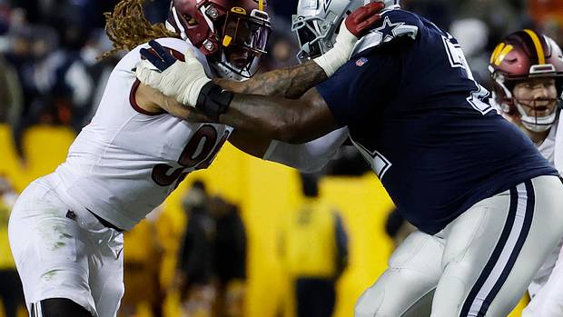 Defensive end Chase Young (left) goes up against a Dallas Cowboys offensive lineman (right).